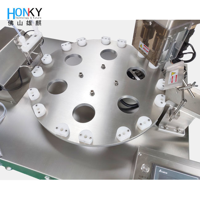 Ημι- αυτόματη μηχανή γεμίσματος υγρών μικρών μπουκαλιών και κάλυψης με σύστημα διπλού καναλιού για συσκευασία μικρών μπουκαλιών με σωλήνες